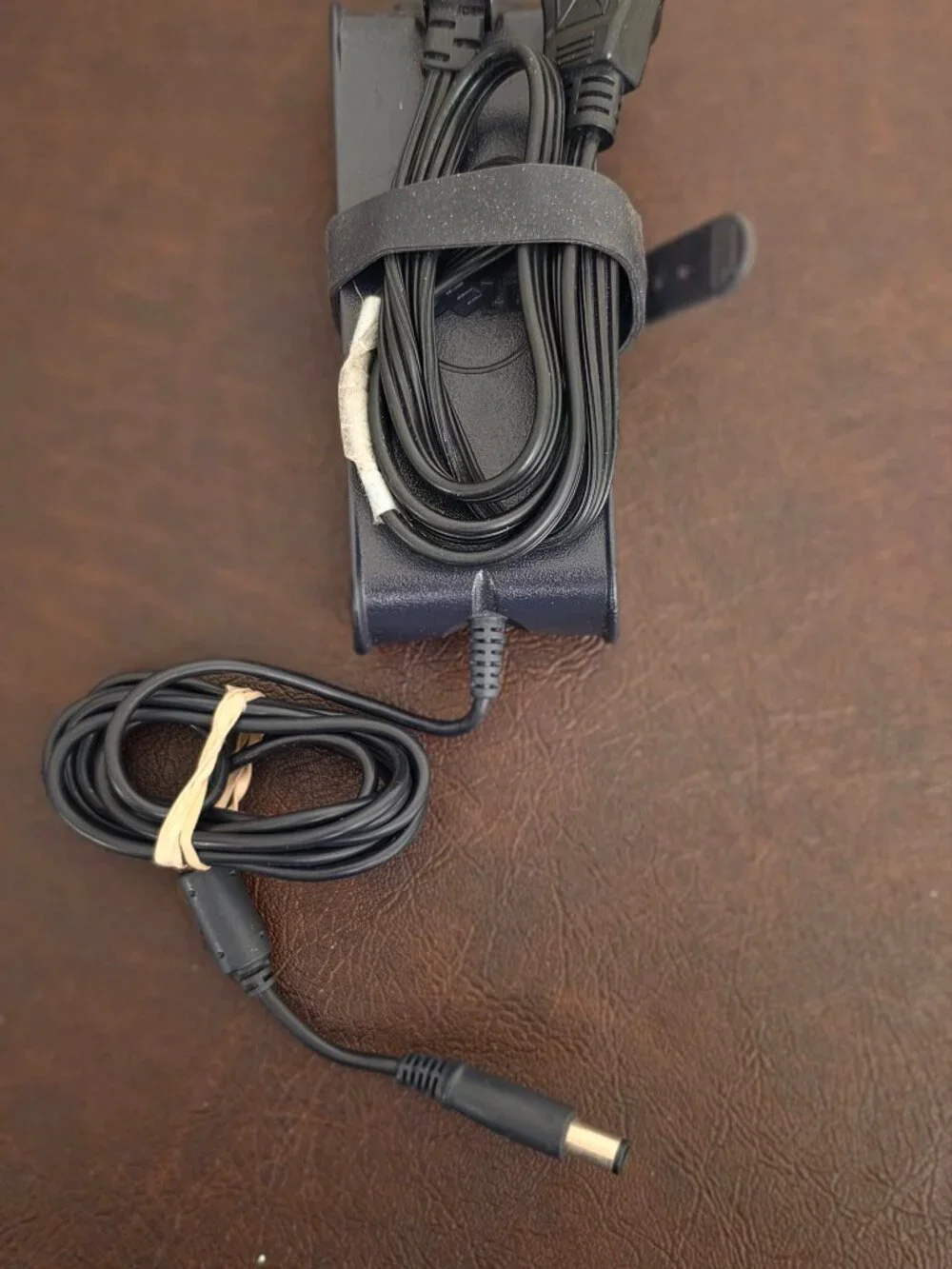 The Dell 90W Laptop Adapter Power Supply Charger -